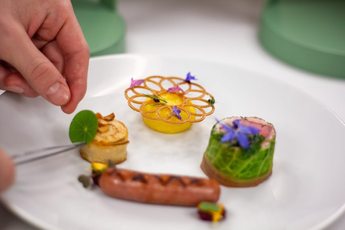 Exquisite culinary presentation with creative gourmet dishes on a white plate.